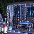 JMEXSUSS 900LED Christmas Curtain Lights Outdoor with Remote, 9.5x29.5ft White Christmas Lights Indoor Plug in, Hanging String Lights for Bedroom Wedding Backdrop Wall Window Xmas Decoration
