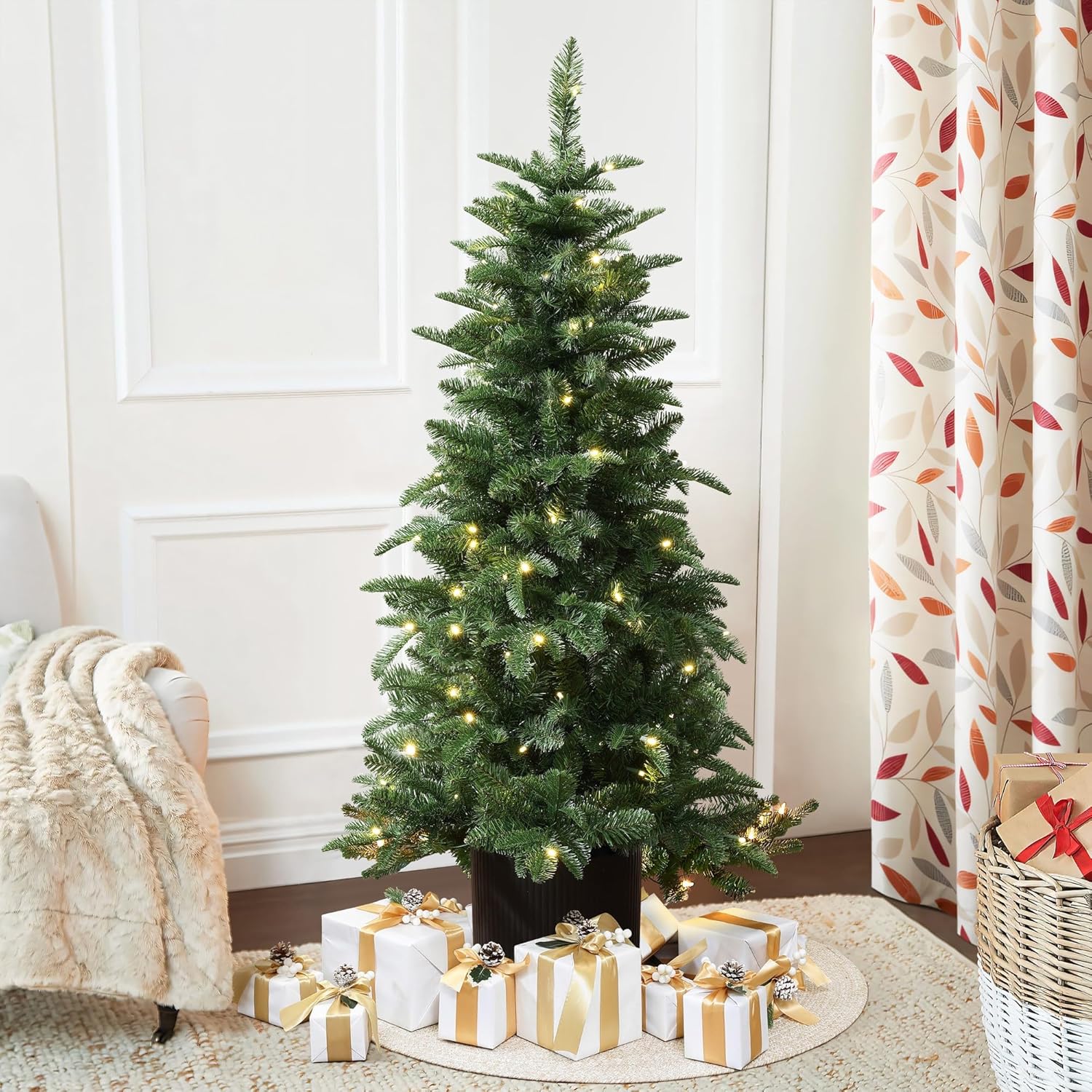 LuxenHome 4.5FT Small Christmas Tree, Prelit Slim Potted Christmas Trees with 100 Warm White LED Lights, Lighted Pine Tree with Fluted Black Pot, Small Faux Holiday Tree for Home Display